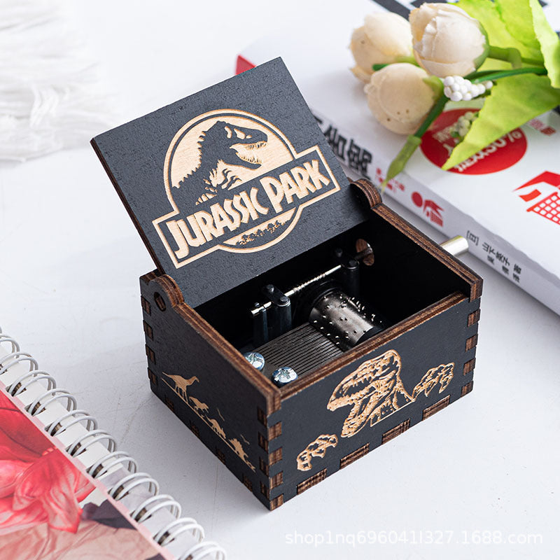 JURASSIC PARK "PREHISTORIC MELODY" WOODEN HAND-CRANK MUSIC BOX